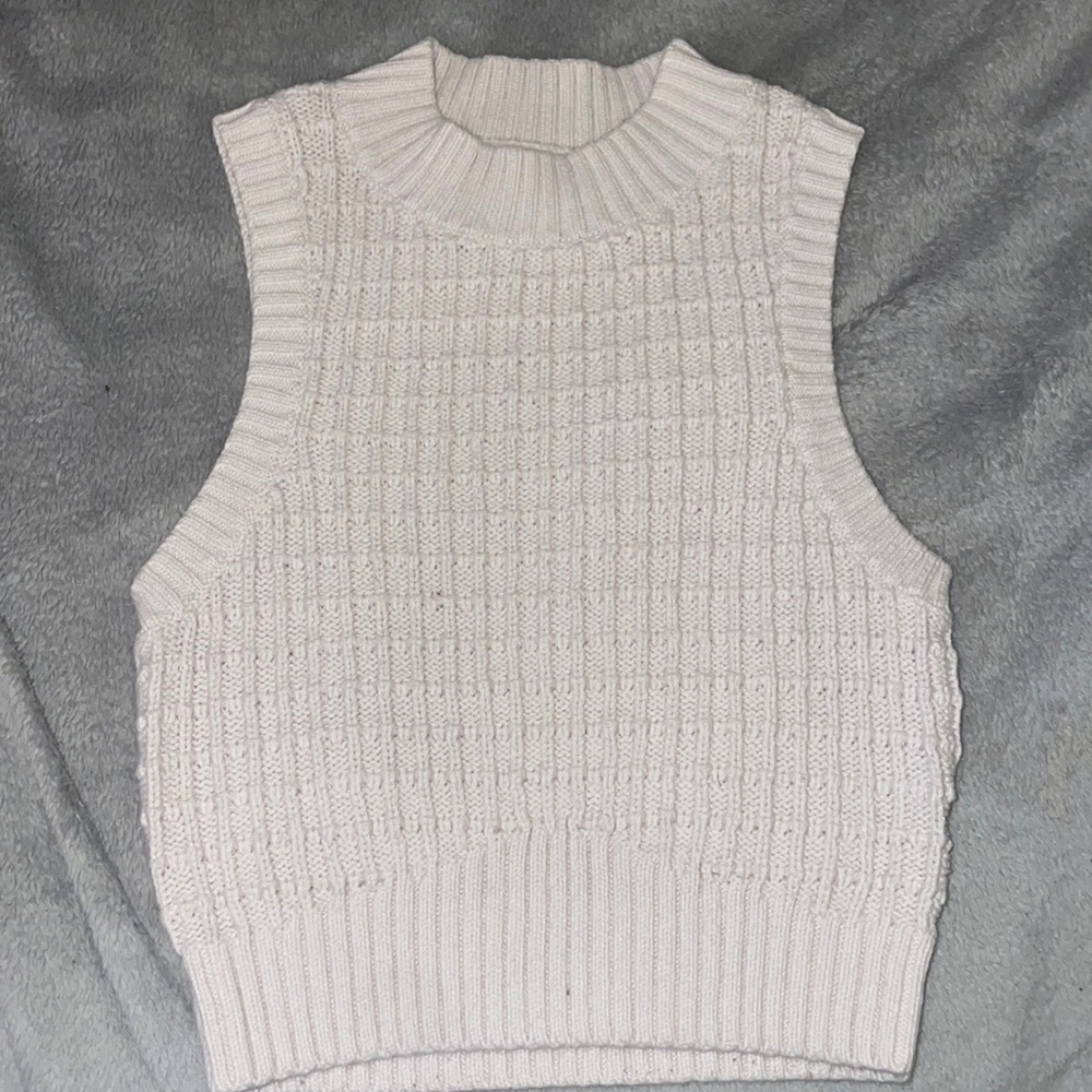 Cream colored sleeveless crop sweater